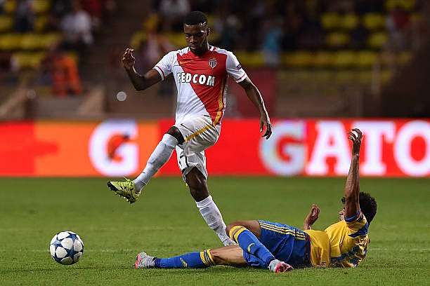 MONACO - AUGUST 25:  Thomas Lemar (L) of Monaco is tackled by Danilo Barbosa of Valencia during the UEFA Champions League qualifying round play off second leg match between Monaco and Valencia on August 25, 2015 in Monaco, Monaco.  (Photo by Valerio Pennicino/Getty Images)